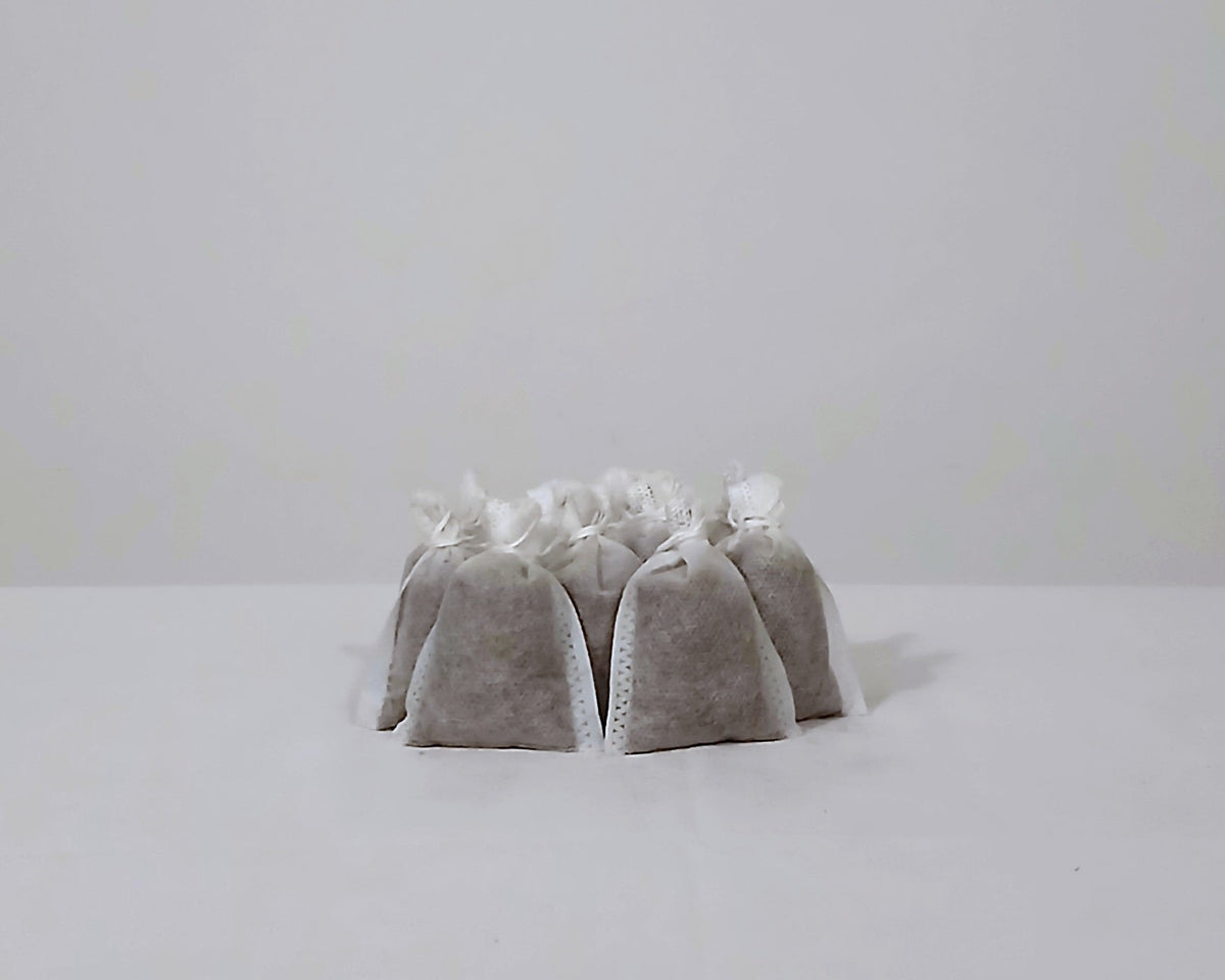 Pre-filled worm fertiliser tea bags stacked